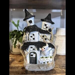 Charming Haunted House Décor with Adorable Ghost